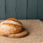 alantu kalamata olive sourdough loaf on board.jpg