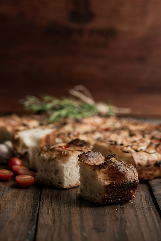 fresh-focaccia-bread-with-tomatoes-and-rosemary-bph3nhjdsra